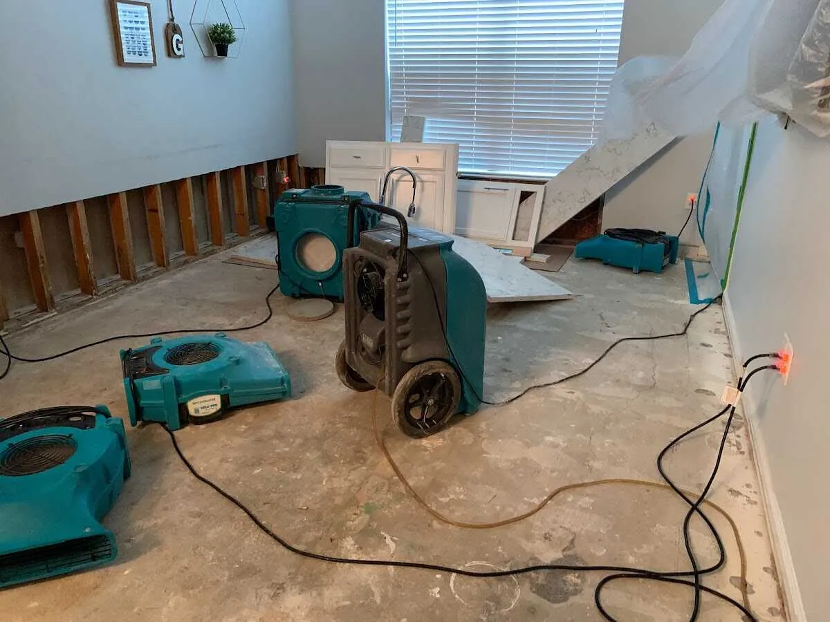 Dehumidifier in flood-cut room for Water Damage Restoration in Jeannette
